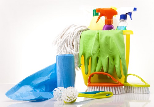 Local cleaner working in a Merton household with stairs and hallway cleaning
