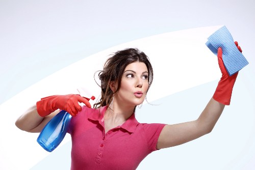 Local cleaner carrying out regular cleaning in a Merton flat